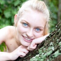 Ash-blonde teen Alli Rae showcases her humungous titties while outside in a thong and OTK socks